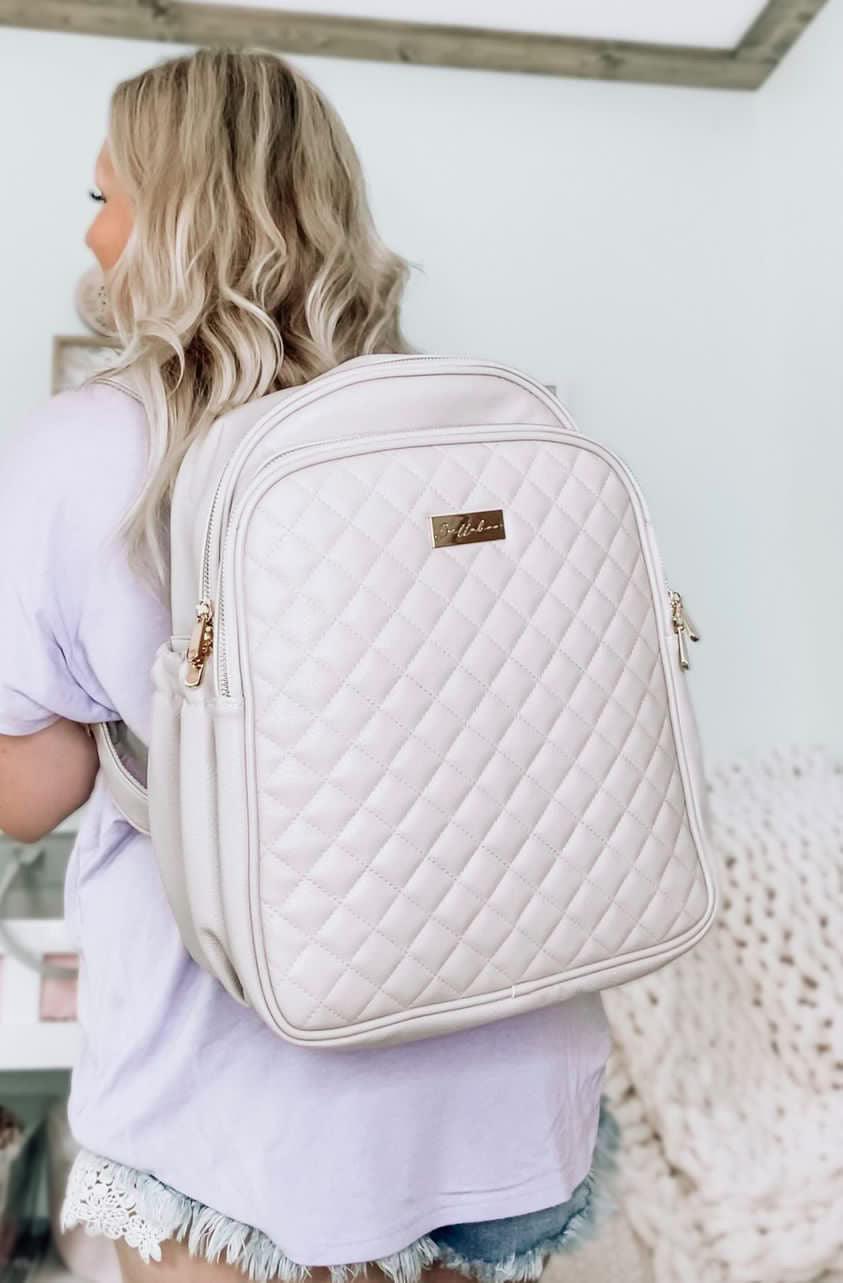 Woman Wearing Diaper Changing Bag in Cream