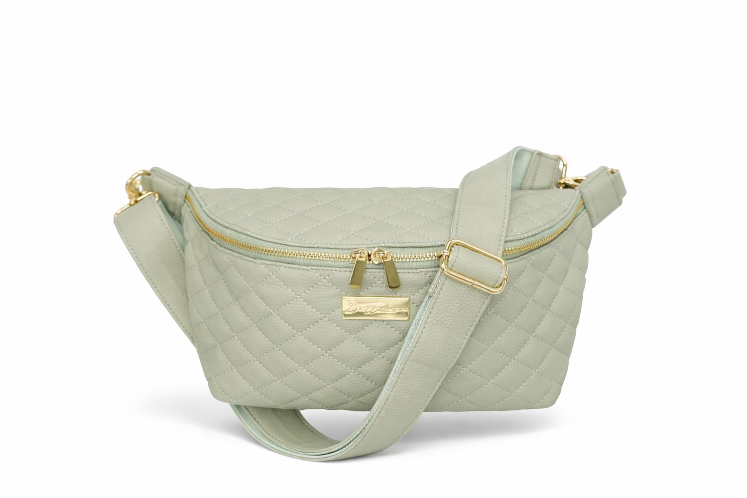 Soft sage green compact crossbody bag in quilted leatherette with gold detail and key leash