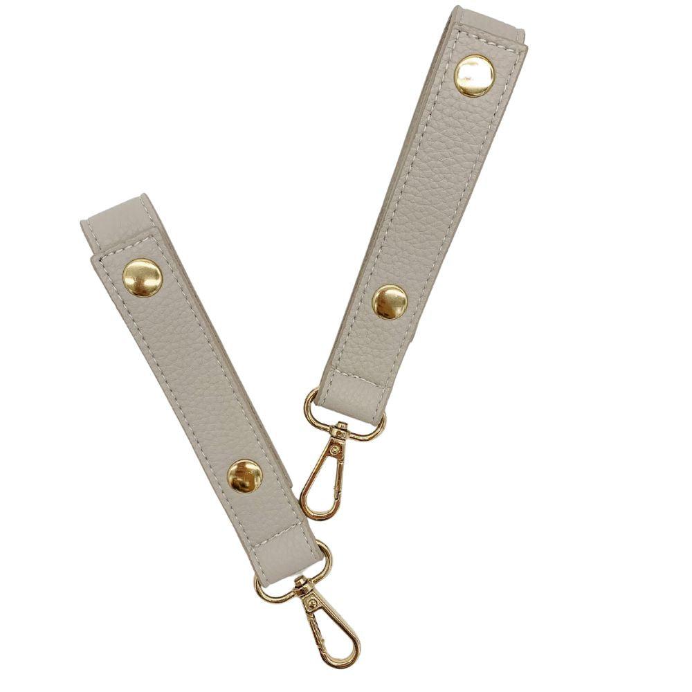 vegan leather diaper changing bag stroller straps cream and gold